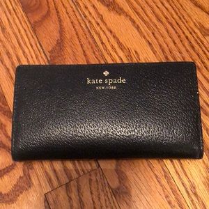 Kate Spade black wallet. Room for cash/ cards and change purse on back side